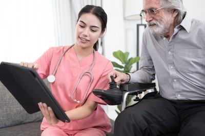 Man an woman reviewing an ipad
