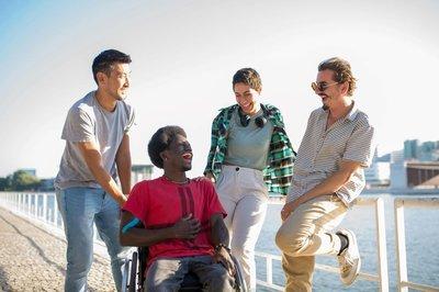 Guy in wheelchair with group of friends
