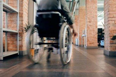 Person in wheelchair moving