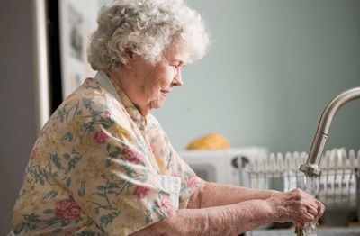 An elder washing hands