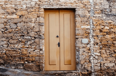 A tone wall and a door